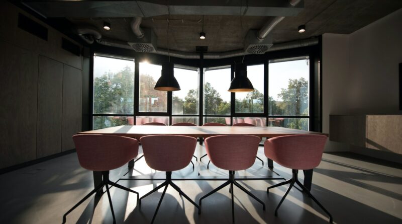 pink dining table with four chairs inside room